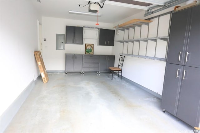 garage featuring a garage door opener and electric panel