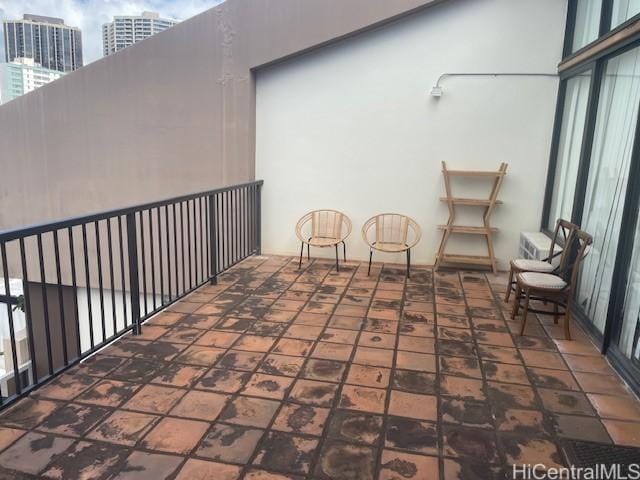 view of patio featuring a balcony