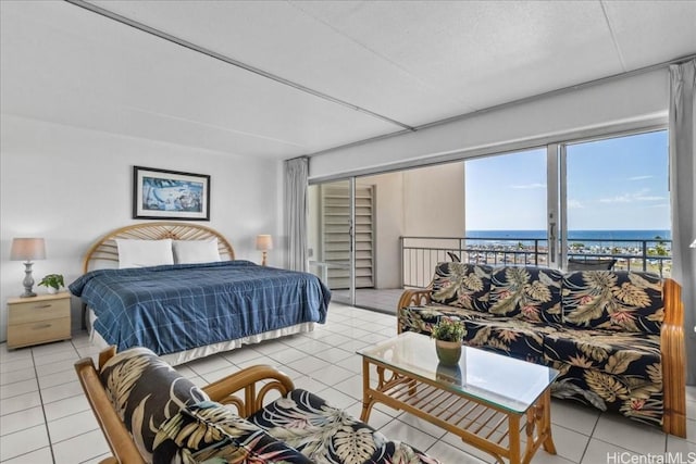 bedroom with access to outside, light tile patterned flooring, a closet, and a water view