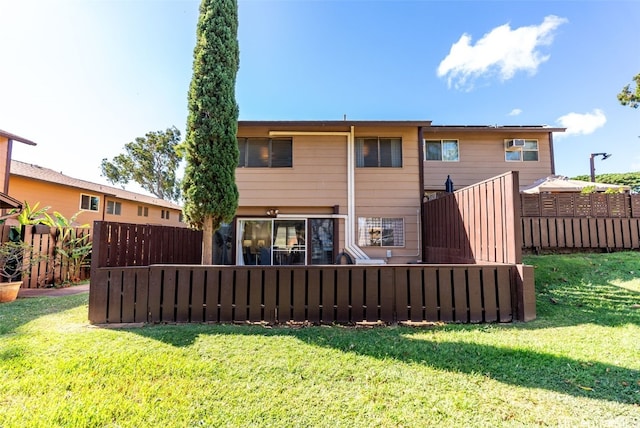 rear view of house with outdoor lounge area and a lawn