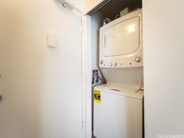 laundry area featuring stacked washer and dryer