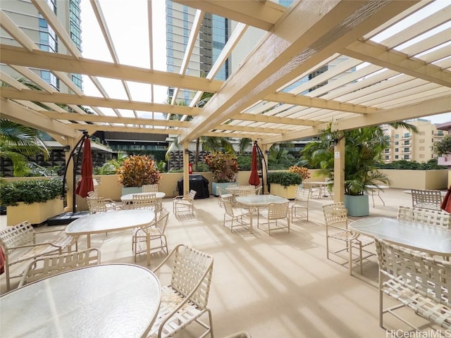 view of patio / terrace featuring area for grilling and a pergola