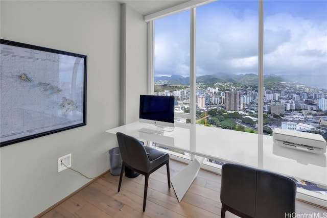 888 Kapiolani Blvd Unit Ph4501, Honolulu, HI 96813 - office space with a wall of windows, wood finished floors, and a wall mounted AC