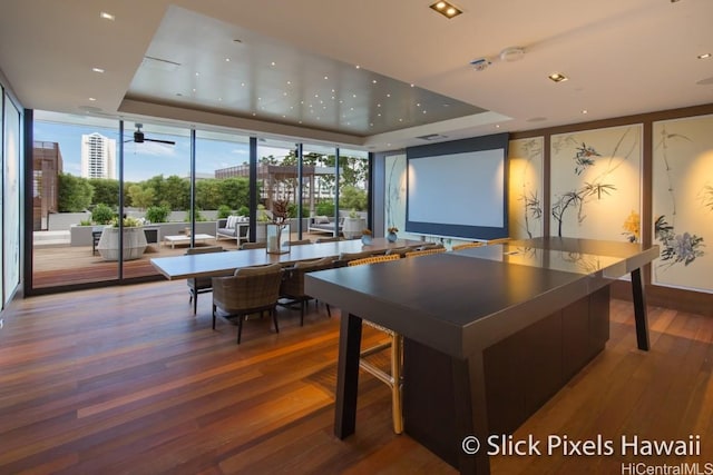 888 Kapiolani Blvd Unit Ph4501, Honolulu, HI 96813 - playroom featuring a tray ceiling, floor to ceiling windows, a city view, and wood finished floors