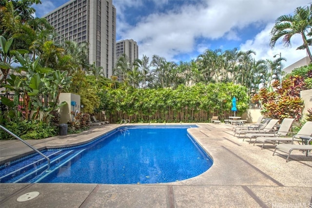 view of swimming pool featuring a patio