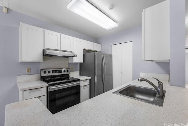 kitchen featuring appliances with stainless steel finishes, sink, and white cabinets