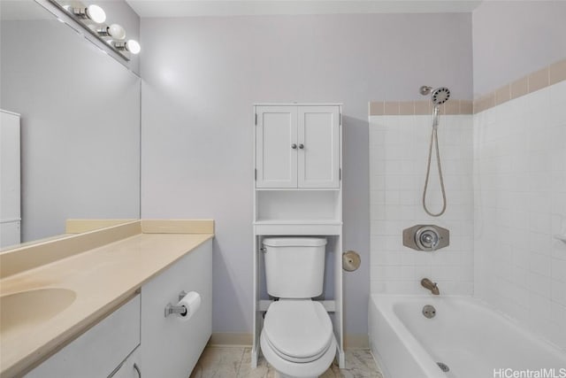 full bathroom with vanity, toilet, and tiled shower / bath combo