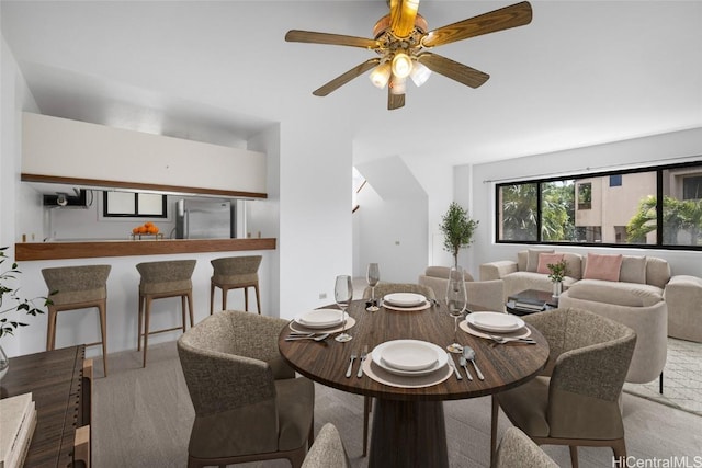 dining room with carpet and ceiling fan