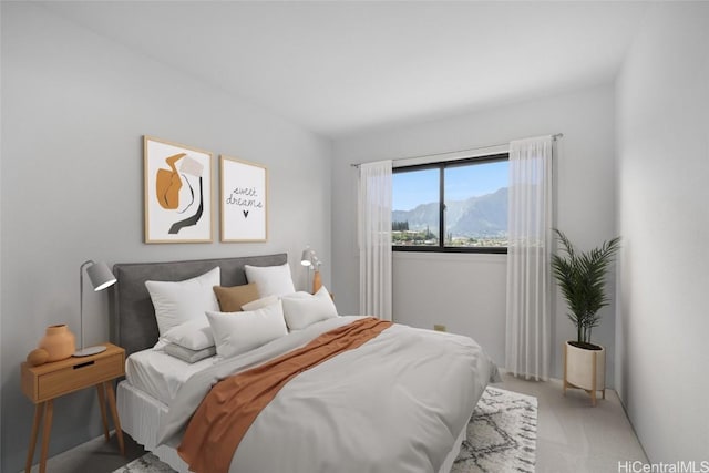 bedroom featuring light colored carpet and a mountain view