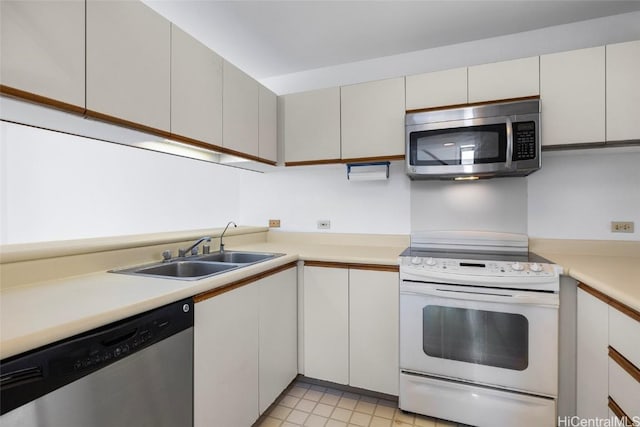 kitchen with white cabinetry, appliances with stainless steel finishes, and sink