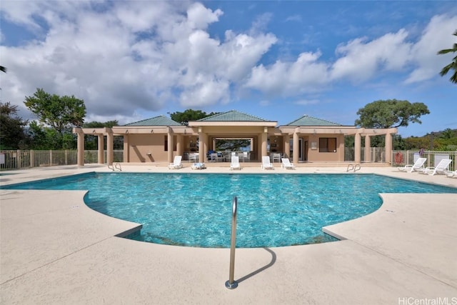 view of swimming pool with a patio