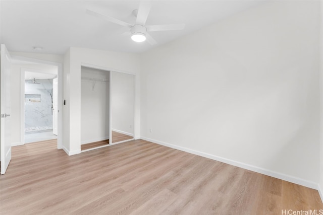 unfurnished bedroom featuring light hardwood / wood-style floors, a closet, and ceiling fan