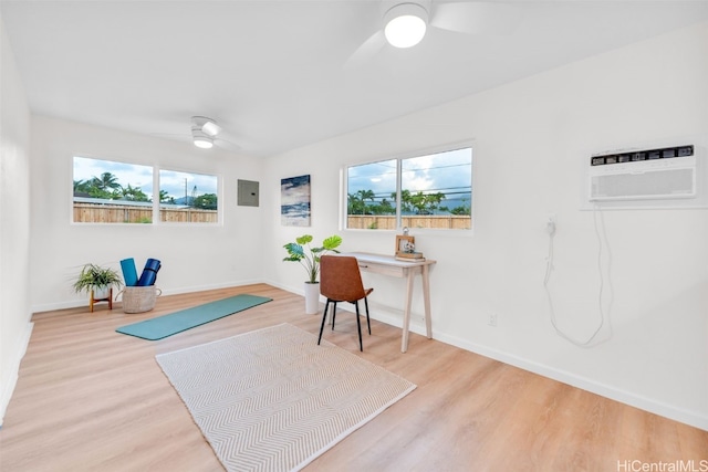 interior space with ceiling fan, light wood-type flooring, and a wealth of natural light