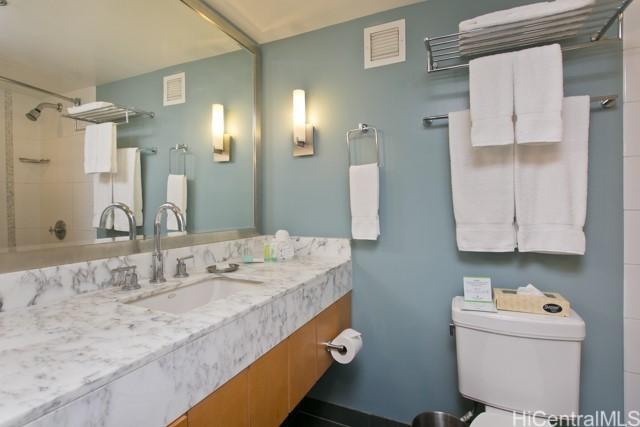 bathroom featuring vanity and toilet