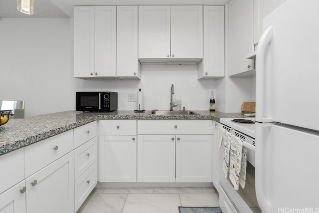 kitchen with white cabinetry, sink, white appliances, and light stone countertops