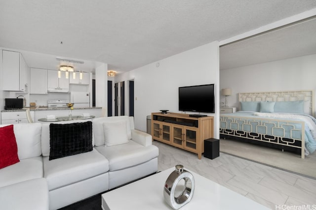 living room with a textured ceiling