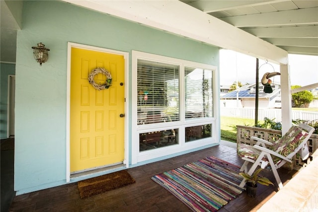 entrance to property with a porch