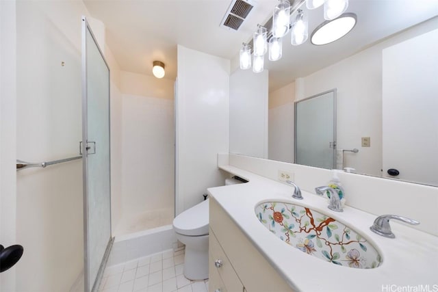 bathroom with vanity, an enclosed shower, tile patterned floors, and toilet