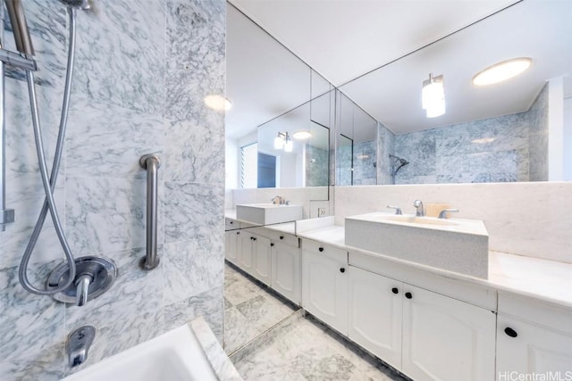 bathroom featuring vanity and tile walls