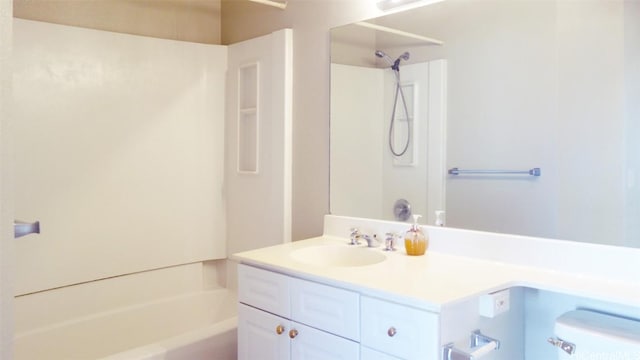 full bathroom featuring shower / tub combination, vanity, and toilet