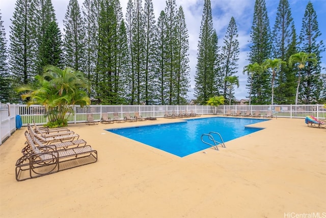 view of pool with a fenced in pool, fence, and a patio area