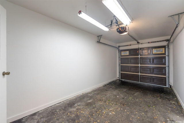 46-010 Aliikane Pl Unit 212, Kaneohe, HI 96744 - garage featuring baseboards and a garage door opener