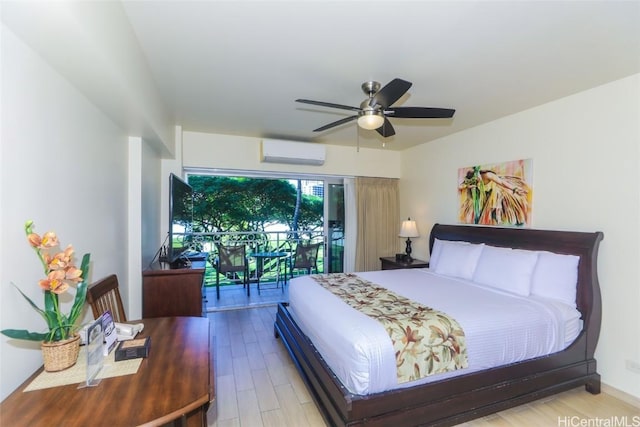 bedroom featuring ceiling fan, access to outside, light hardwood / wood-style floors, and a wall mounted AC