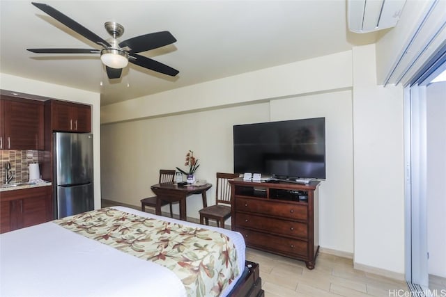 bedroom with ceiling fan, stainless steel fridge, and sink