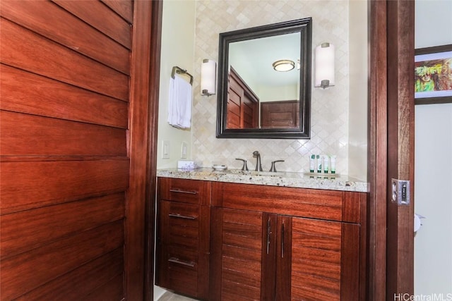 bathroom with vanity and backsplash