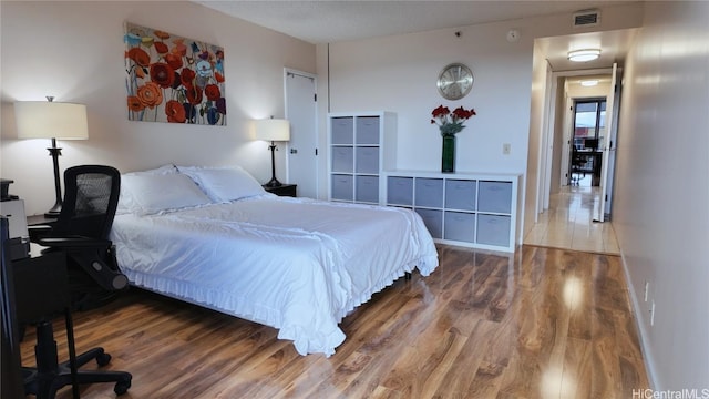 bedroom featuring hardwood / wood-style flooring