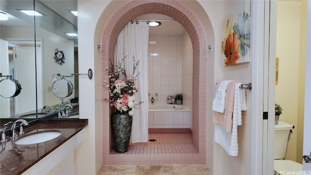 full bathroom with vanity, shower / tub combo with curtain, tile patterned floors, and toilet