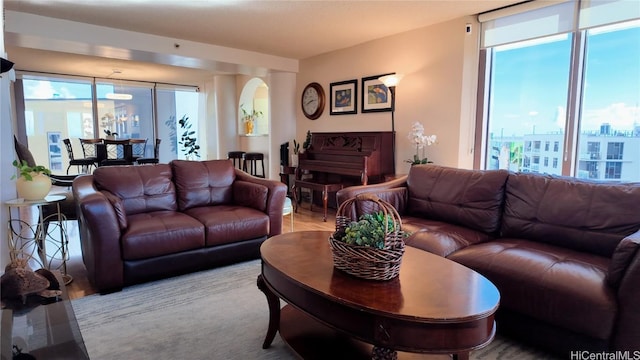 living room with plenty of natural light and light hardwood / wood-style floors