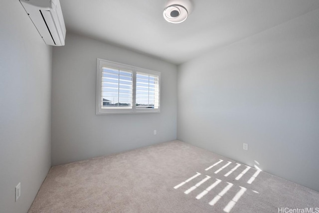 unfurnished room with light colored carpet and a wall mounted air conditioner