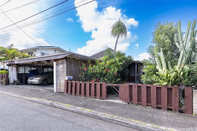 view of home's exterior featuring a carport