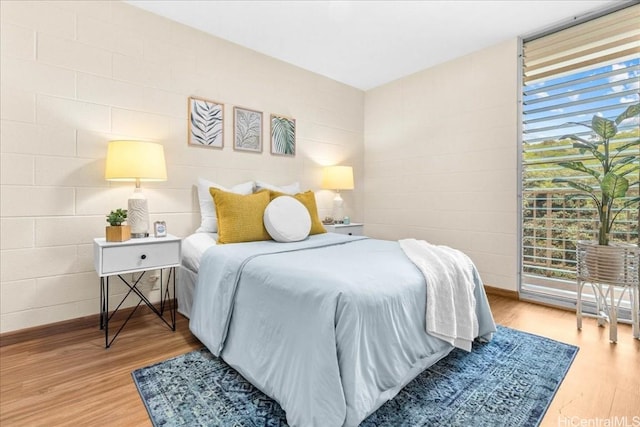 bedroom with wood finished floors