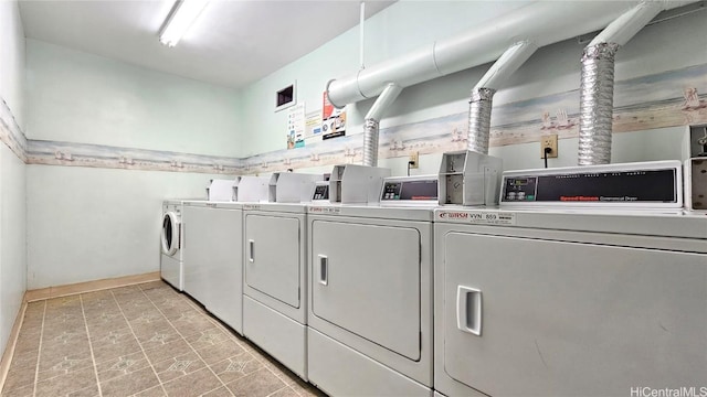 washroom with separate washer and dryer