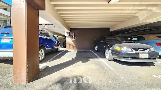 view of parking featuring a parking deck