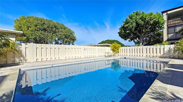 view of swimming pool with a fenced backyard and a fenced in pool