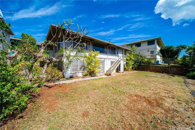 back of property with a yard
