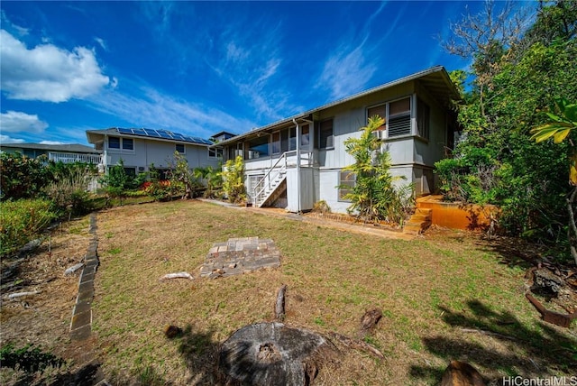 view of side of home featuring a yard