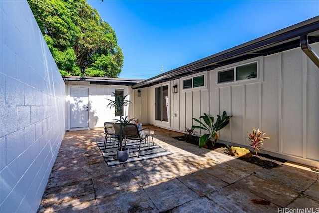 view of patio / terrace featuring fence