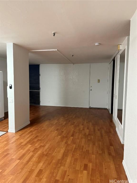 unfurnished room featuring hardwood / wood-style floors