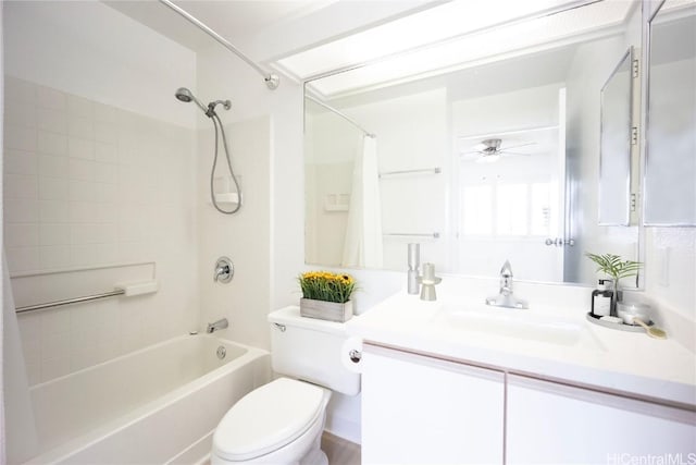 full bathroom with vanity, shower / tub combo, ceiling fan, and toilet