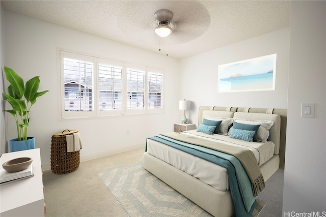 bedroom featuring light carpet and a textured ceiling