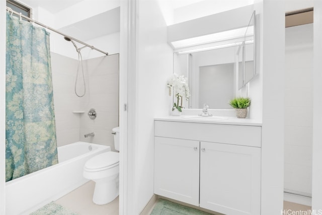 full bath featuring shower / bath combo, vanity, and toilet