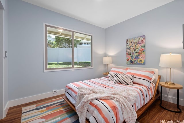 bedroom with hardwood / wood-style flooring