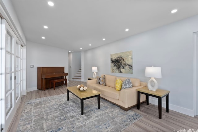 living room with light hardwood / wood-style flooring