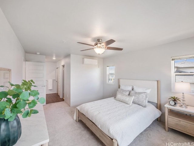 carpeted bedroom featuring ceiling fan and a wall mounted air conditioner