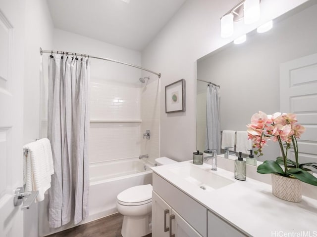 full bathroom featuring vanity, toilet, shower / tub combo, and wood-type flooring