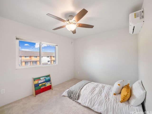 bedroom featuring a wall unit AC, light colored carpet, and ceiling fan